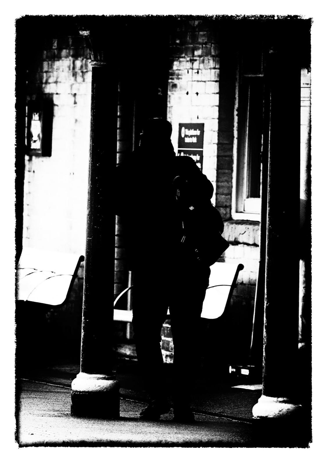 Figure in the shadowed station doorway — high-contrast Knaresborough frame