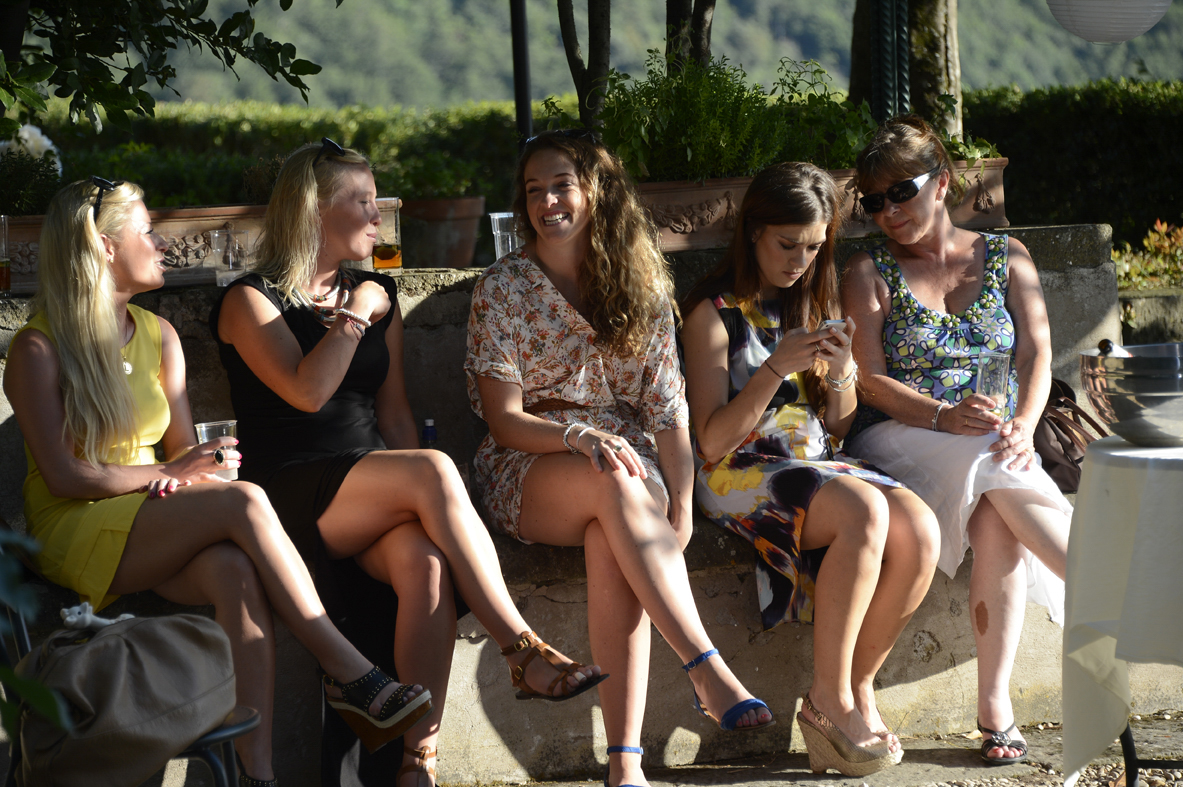 Gallery 3 — five women on wall laughing