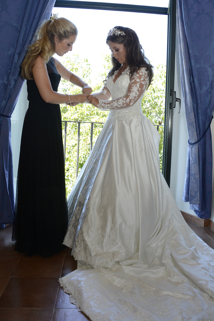 Gallery 5 — bridesmaid fastening bride's wrist